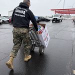 A toys for Tots representative collecting the boxes